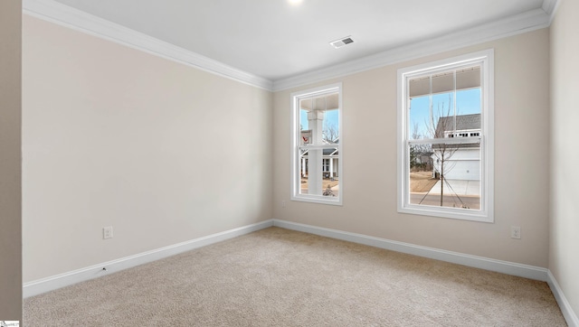 carpeted empty room featuring ornamental molding, visible vents, and baseboards