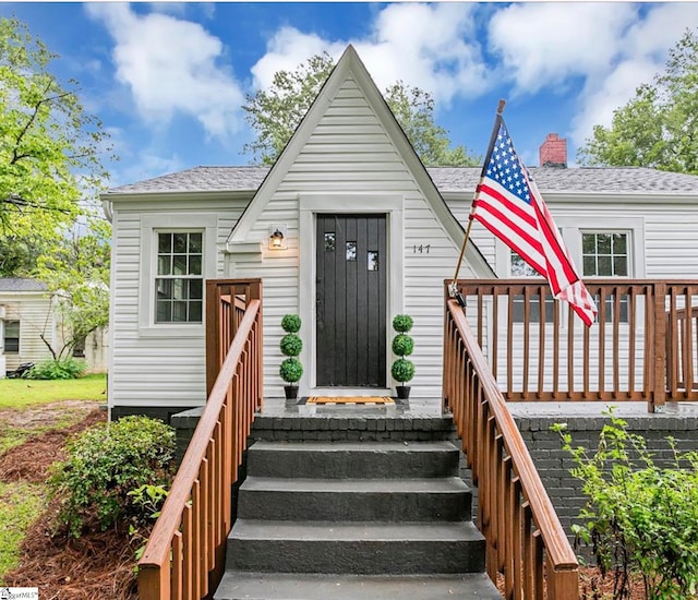 view of front of home featuring a wooden deck