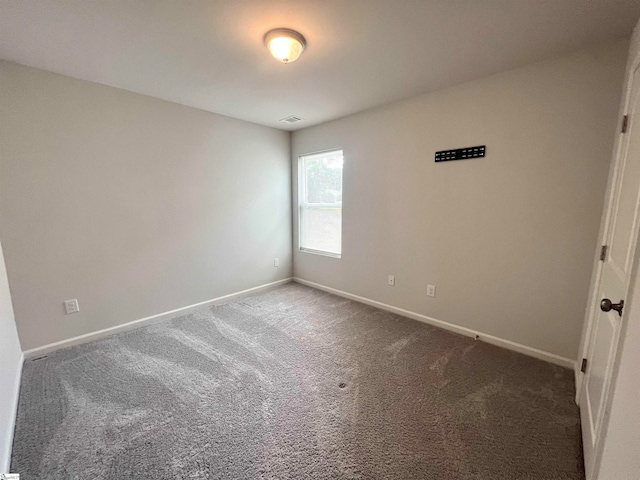 spare room with carpet floors