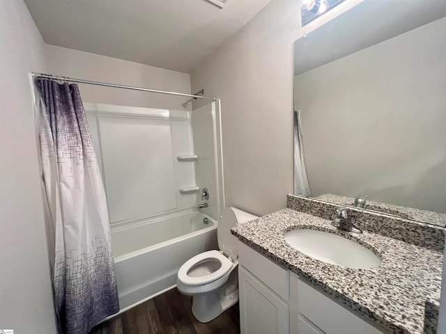 full bathroom featuring vanity, shower / tub combo with curtain, toilet, and hardwood / wood-style floors