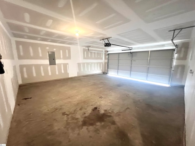 garage with electric panel and a garage door opener