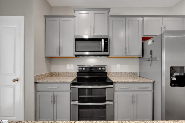 kitchen with sink, dark hardwood / wood-style flooring, a healthy amount of sunlight, and a kitchen island with sink