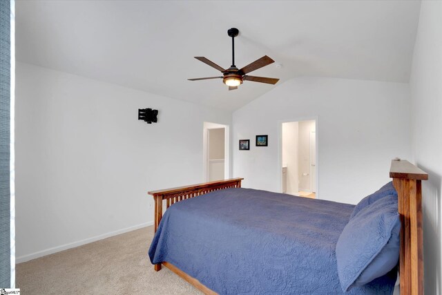 bedroom with lofted ceiling, light colored carpet, and ceiling fan