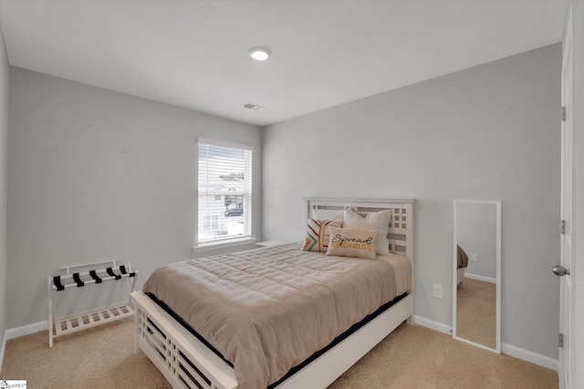 bedroom with light carpet