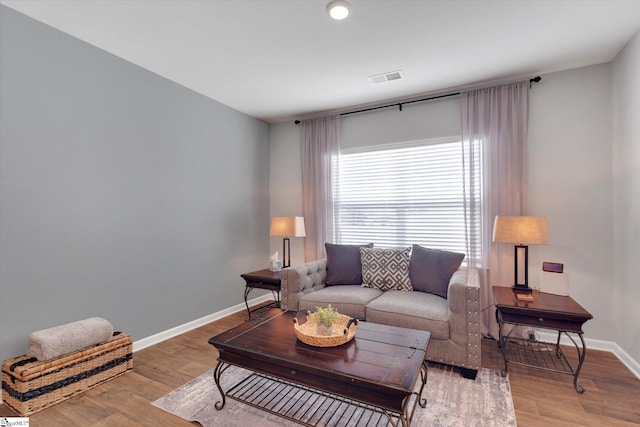 living room with light hardwood / wood-style flooring