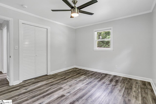 unfurnished bedroom with ceiling fan, a closet, ornamental molding, and hardwood / wood-style floors