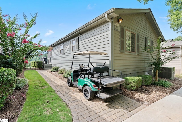 view of side of property with central AC