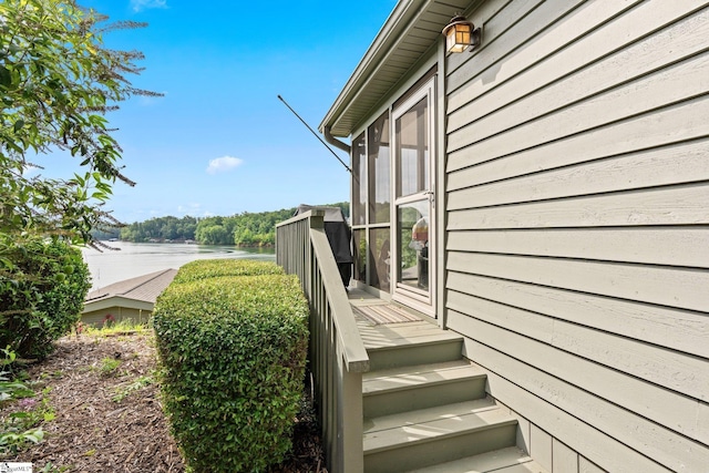 view of property exterior with a water view