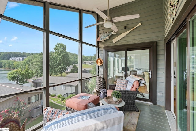 sunroom / solarium featuring ceiling fan