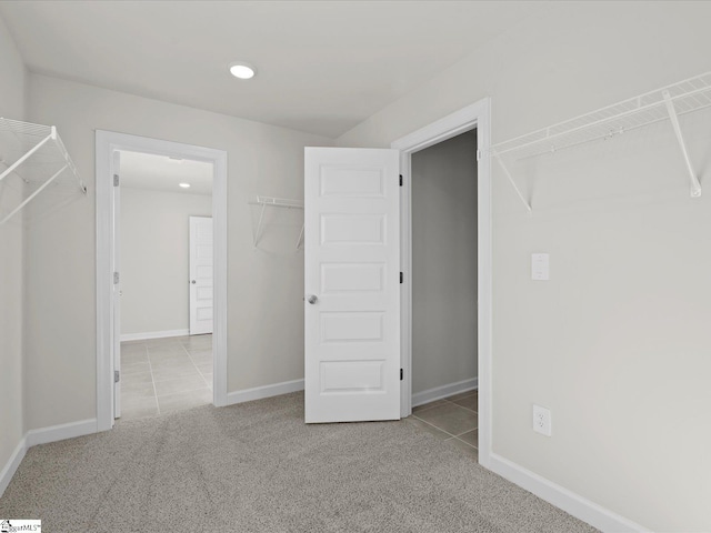 spacious closet featuring light tile patterned flooring