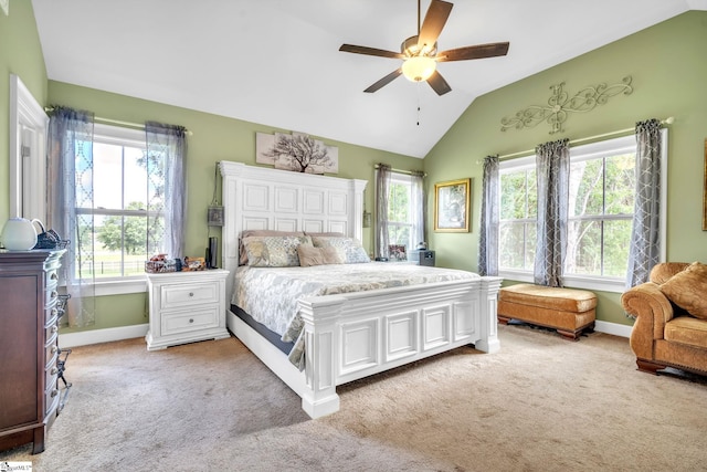 bedroom featuring lofted ceiling, light carpet, and ceiling fan