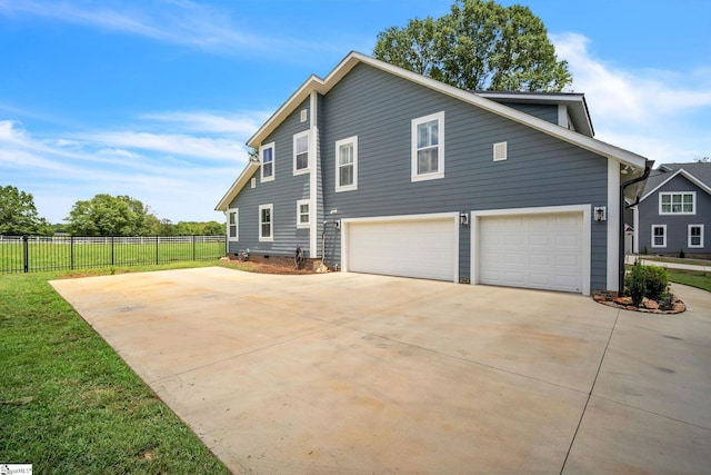 view of side of property with a garage