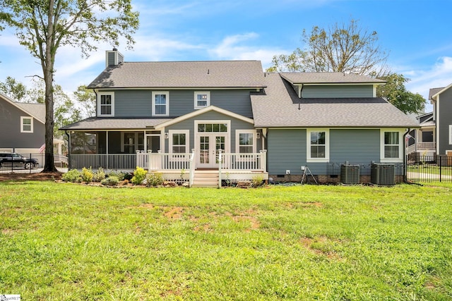 back of house with a wooden deck, a yard, a sunroom, and central air condition unit