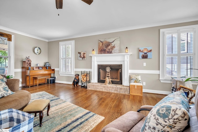 living room featuring crown molding and a wealth of natural light