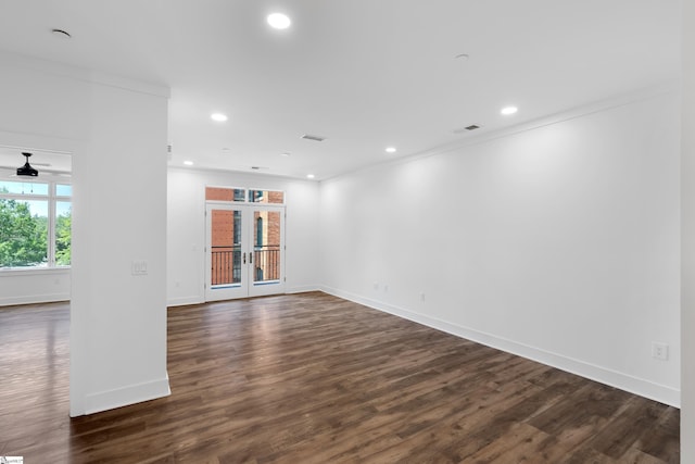 spare room with french doors, dark hardwood / wood-style flooring, and ceiling fan