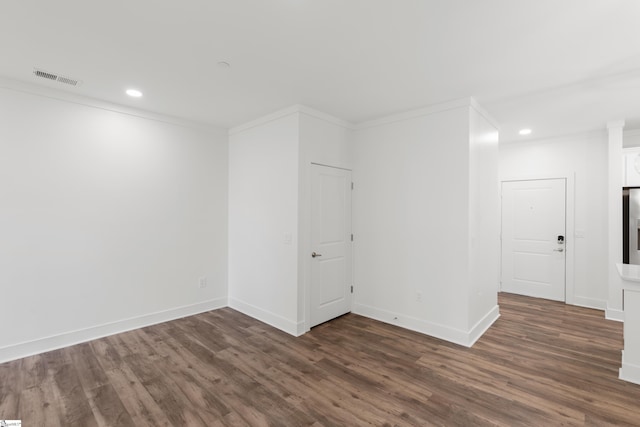 unfurnished room with crown molding and hardwood / wood-style floors