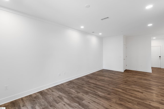 unfurnished room with hardwood / wood-style flooring and ornamental molding