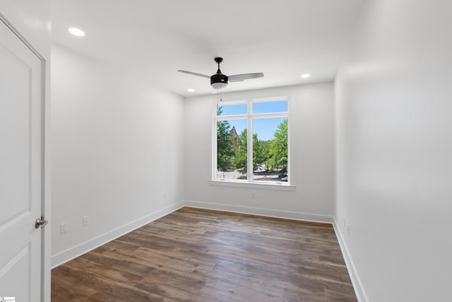 spare room with hardwood / wood-style flooring and ceiling fan