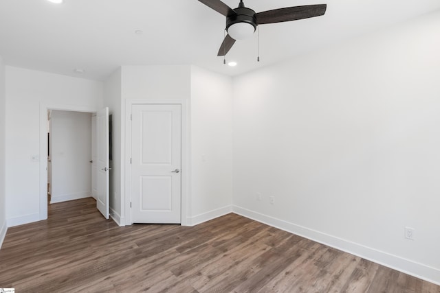 unfurnished bedroom with wood-type flooring and ceiling fan