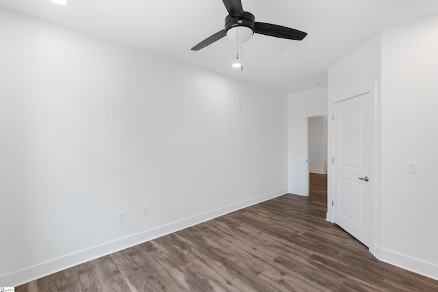 empty room featuring ceiling fan and hardwood / wood-style floors