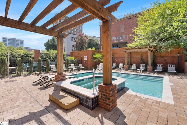 view of swimming pool with a pergola and a community hot tub