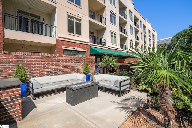 view of patio / terrace featuring a balcony and an outdoor living space