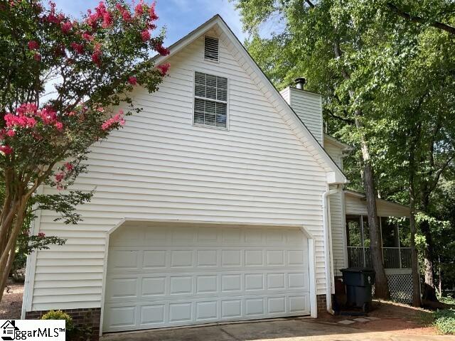 view of property exterior with a garage