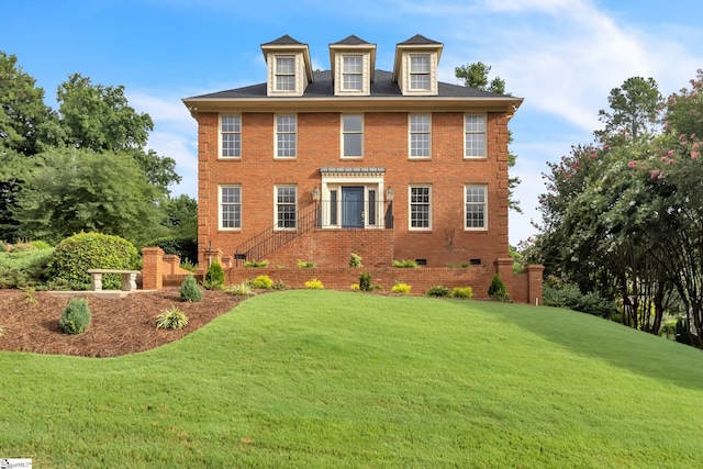 view of home's exterior featuring crawl space, a lawn, and brick siding