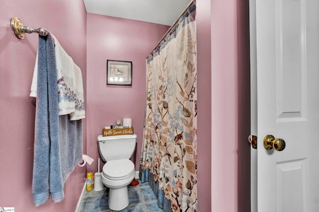 bathroom featuring tile patterned floors and toilet