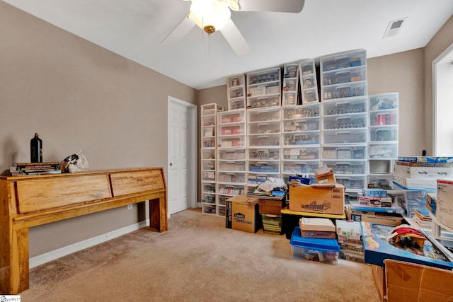 home office featuring light colored carpet and ceiling fan