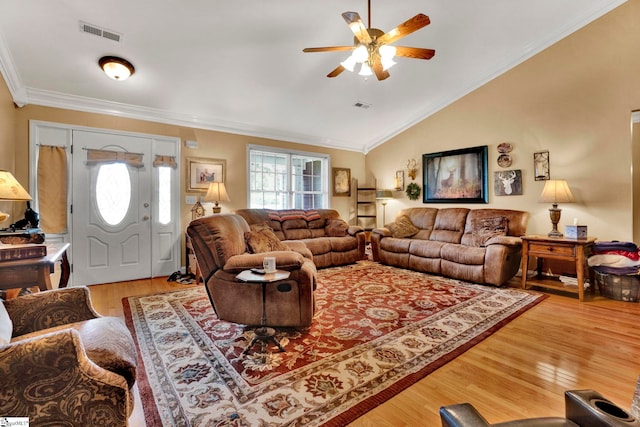 living room with light hardwood / wood-style floors, crown molding, vaulted ceiling, and ceiling fan