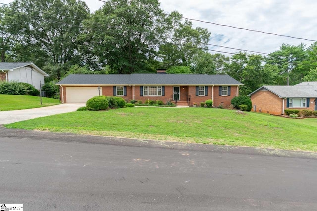 ranch-style home with a garage and a front yard