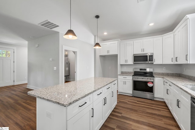 kitchen with white cabinetry, a center island, dark wood-type flooring, stainless steel appliances, and decorative light fixtures