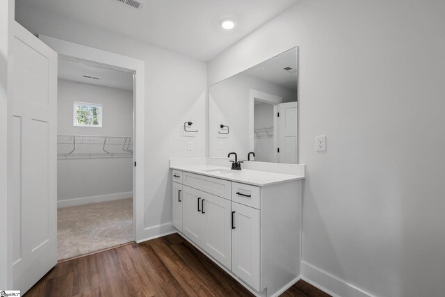 bathroom featuring vanity and hardwood / wood-style flooring