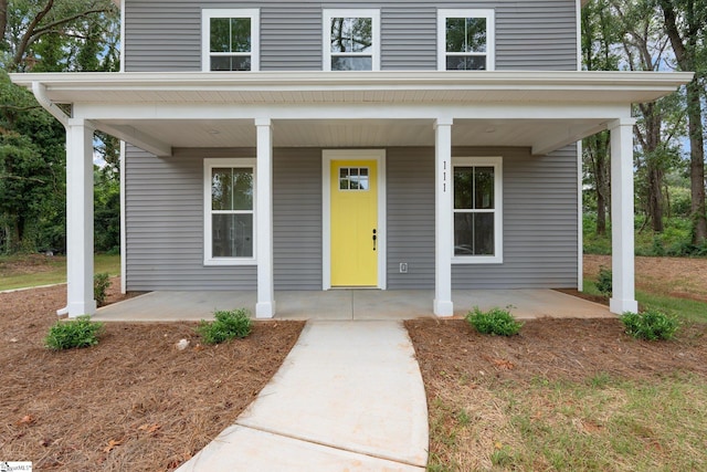 property entrance with covered porch