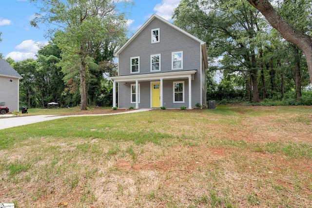 view of front of home with covered porch and a front yard