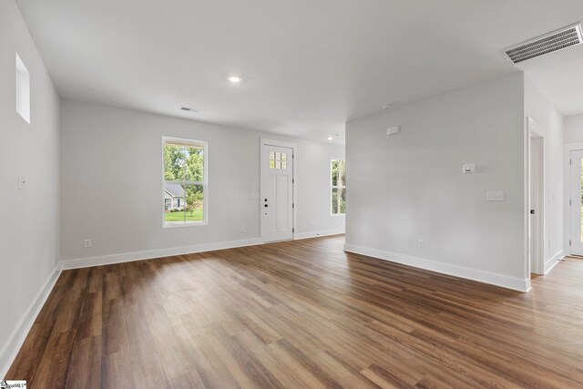 spare room with hardwood / wood-style flooring