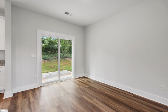 unfurnished dining area with dark hardwood / wood-style floors