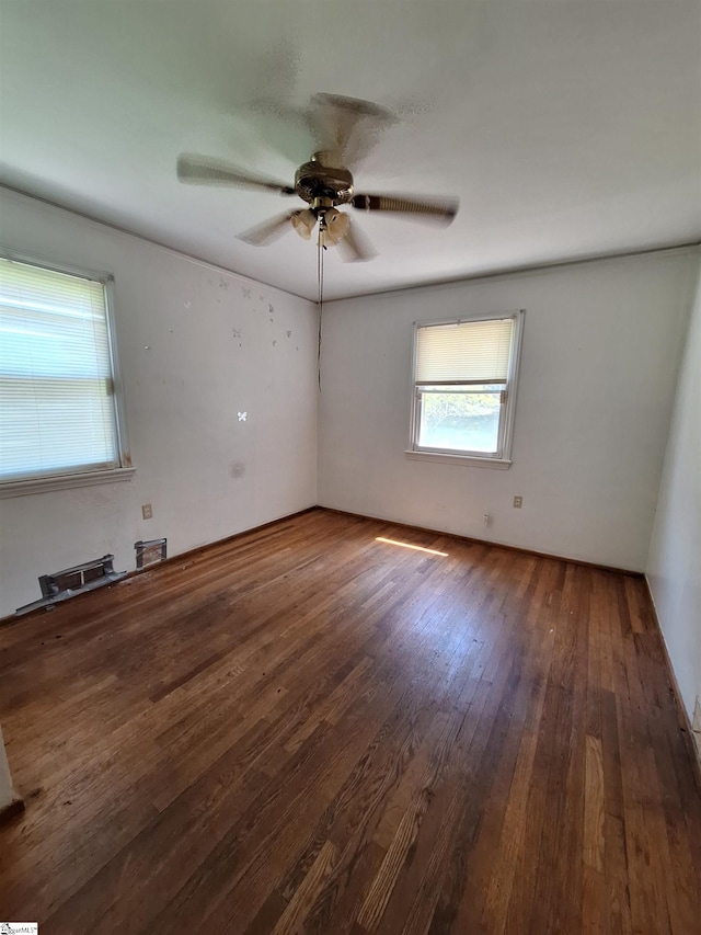 empty room featuring wood-type flooring and ceiling fan