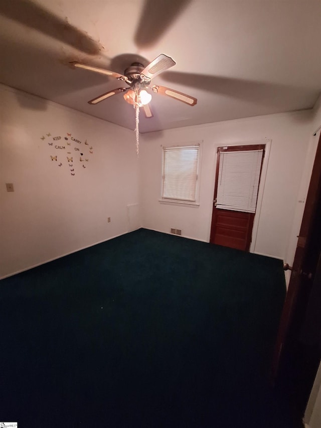 unfurnished bedroom featuring ceiling fan