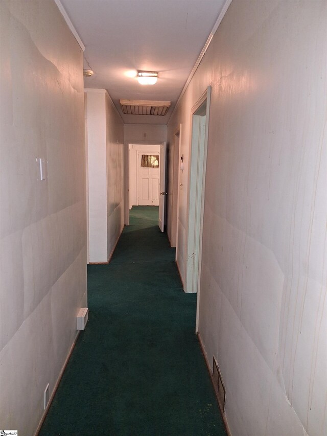 hallway featuring dark carpet