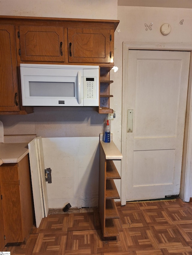 kitchen featuring dark parquet floors