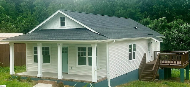 back of house featuring a wooden deck