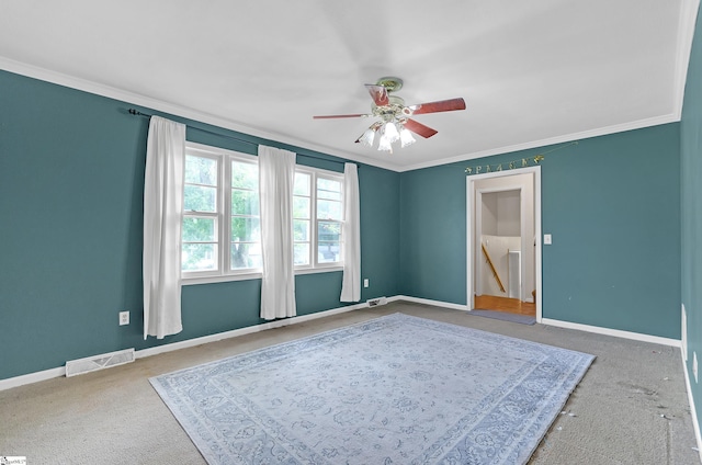 bedroom with crown molding, ceiling fan, connected bathroom, and carpet flooring