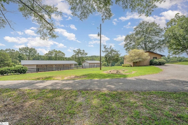 view of community featuring a lawn