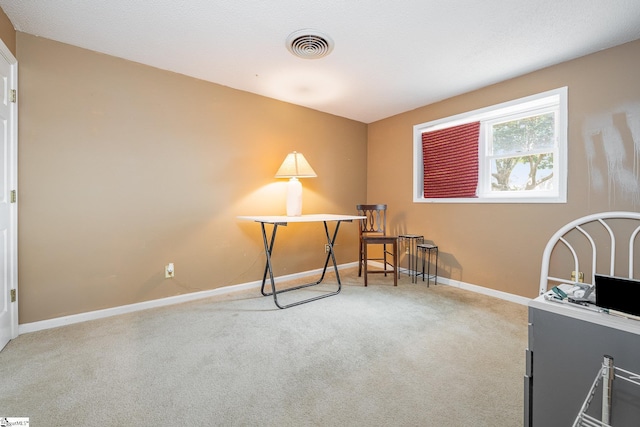 carpeted home office with visible vents and baseboards