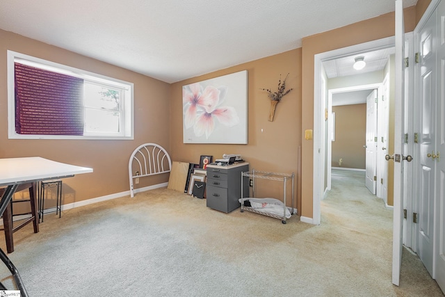 misc room with light carpet and baseboards