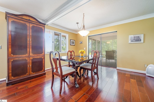 dining space with dark wood-style floors, ornamental molding, beamed ceiling, and baseboards