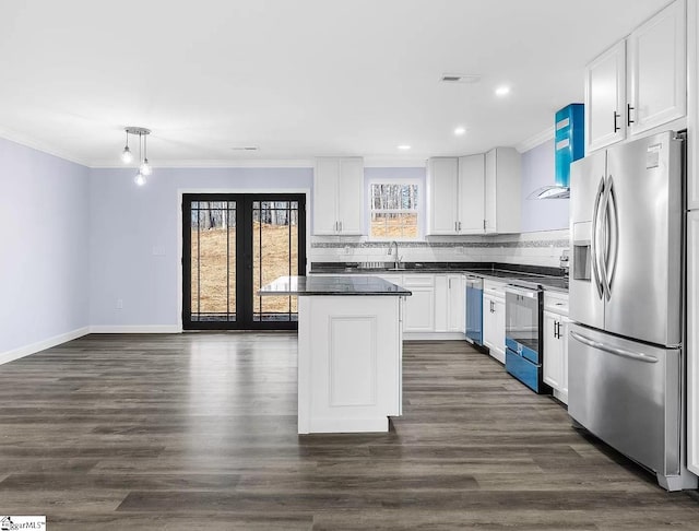 kitchen with white cabinetry, tasteful backsplash, stainless steel appliances, a center island, and dark wood-type flooring