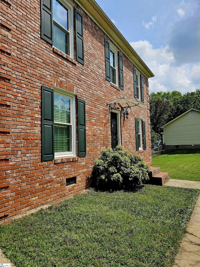 view of home's exterior featuring a lawn